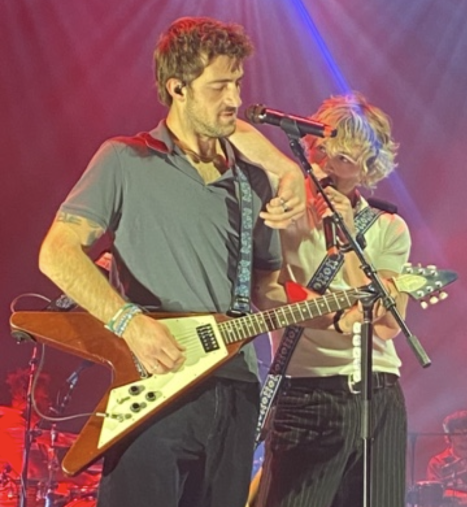 Lead singer Ross Lynch leans on guitarist Rocky Lynch during performance on April 11 at Steelhouse Omaha. Photo by London Woodard.